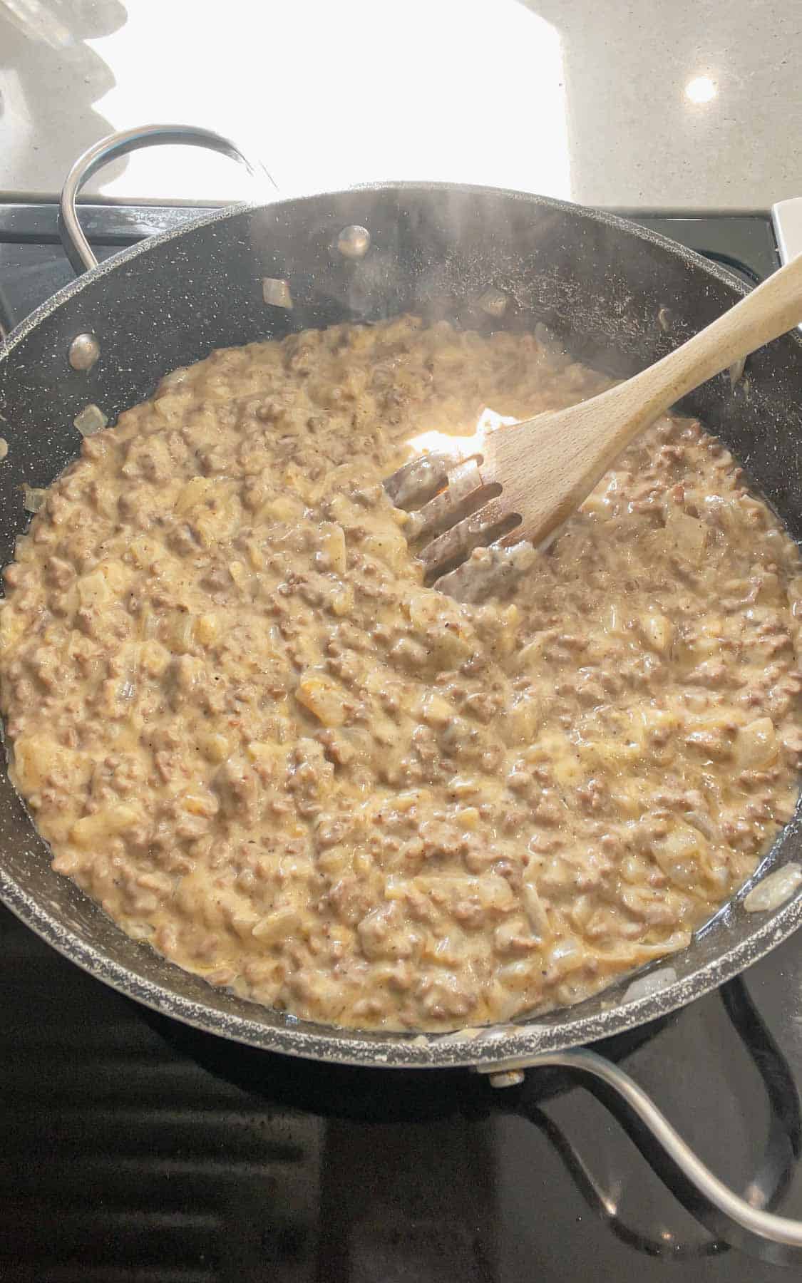 creamy ground beef and soup mixture in a skillet