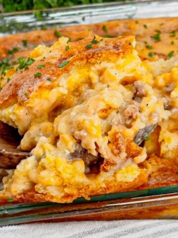 Cheddar Bay Ground Beef Cobbler is a hearty casserole recipe with a creamy and cheesy ground beef base and a Red Lobster Cheddar Bay Biscuit topping.