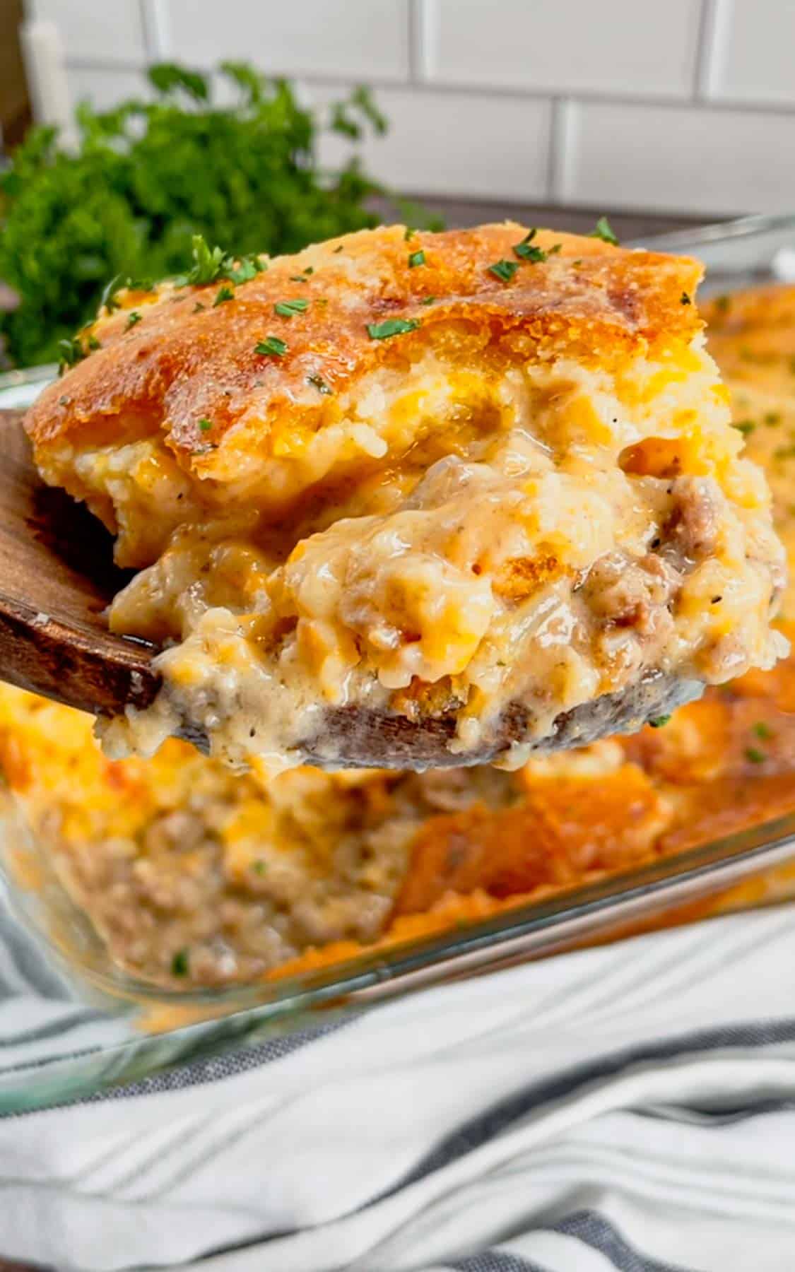 Cheddar Bay Ground Beef Cobbler is a hearty casserole recipe with a creamy and cheesy ground beef base and a Red Lobster Cheddar Bay Biscuit topping.