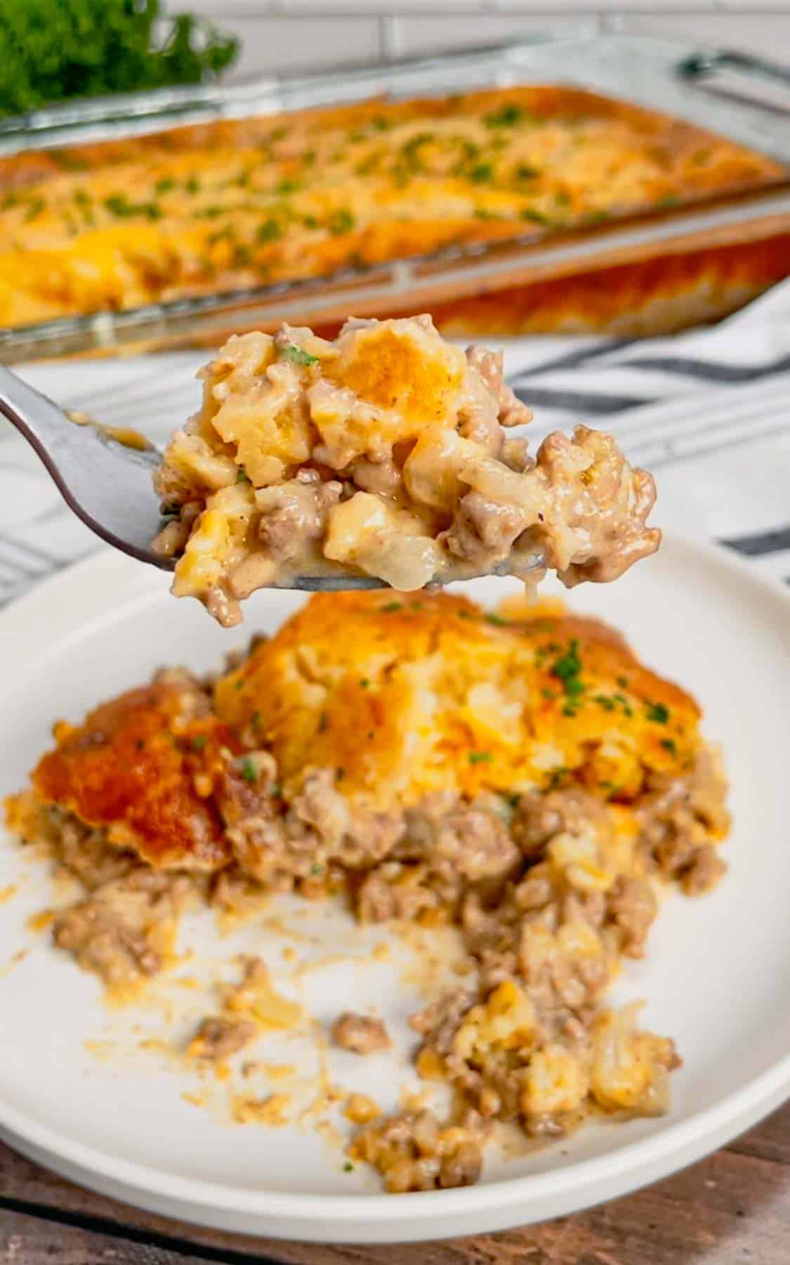 Cheddar Bay Ground Beef Cobbler is a hearty casserole recipe with a creamy and cheesy ground beef base and a Red Lobster Cheddar Bay Biscuit topping.