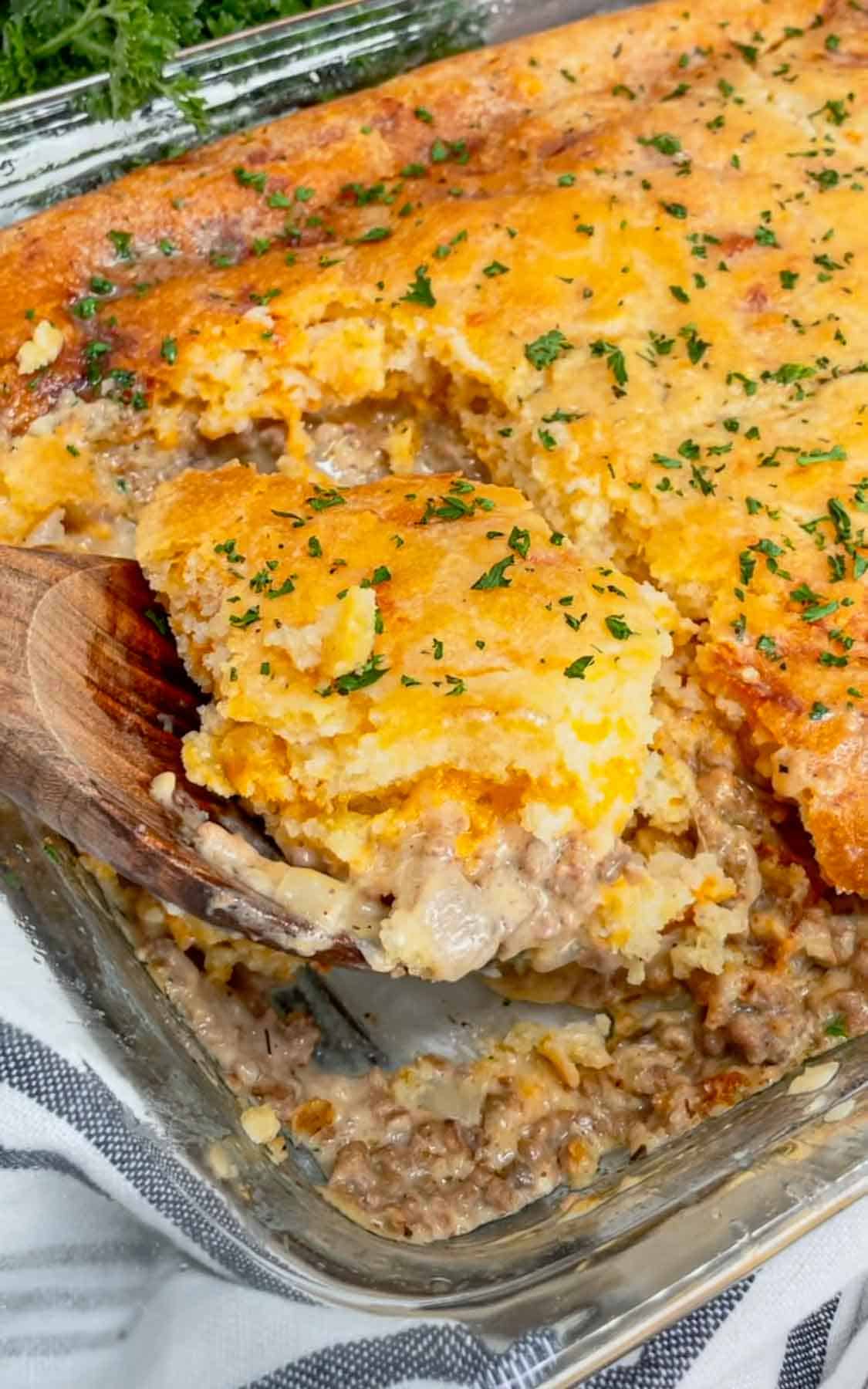 Cheddar Bay Ground Beef Cobbler is a hearty casserole recipe with a creamy and cheesy ground beef base and a Red Lobster Cheddar Bay Biscuit topping.
