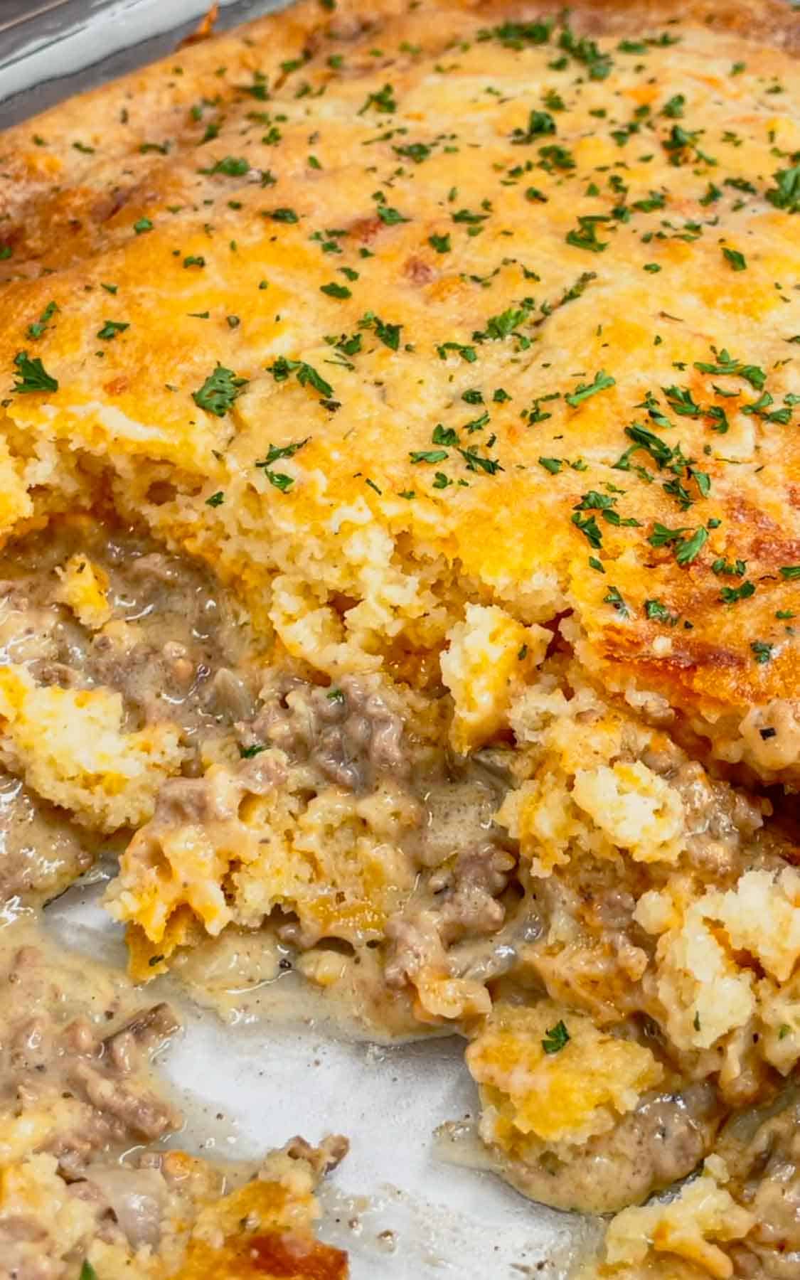 Cheddar Bay Ground Beef Cobbler is a hearty casserole recipe with a creamy and cheesy ground beef base and a Red Lobster Cheddar Bay Biscuit topping.