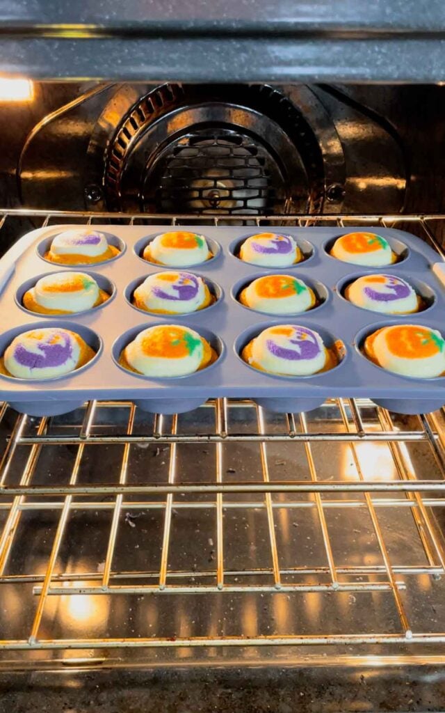 halloween sugar cookie brownies baking in a muffin tin in that oven