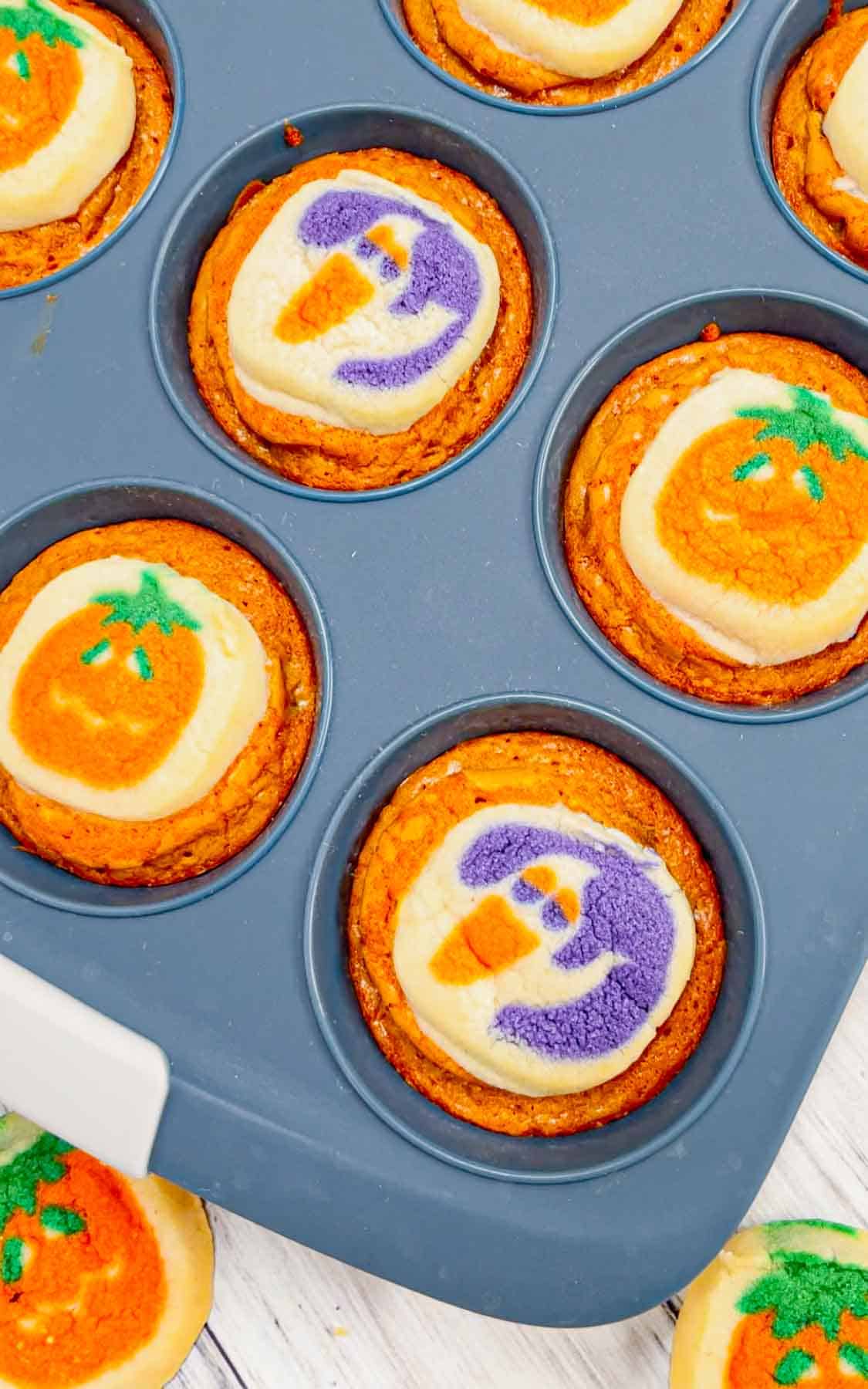 Halloween Sugar Cookie Brownies are a fun and tasty treat made in muffin tins with a dyed orange brownie base topped with Pillsbury Halloween sugar cookies.