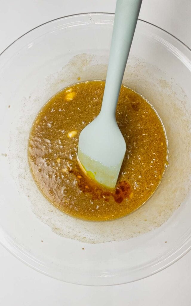 yellow food colouring added to bowl with brownie batter