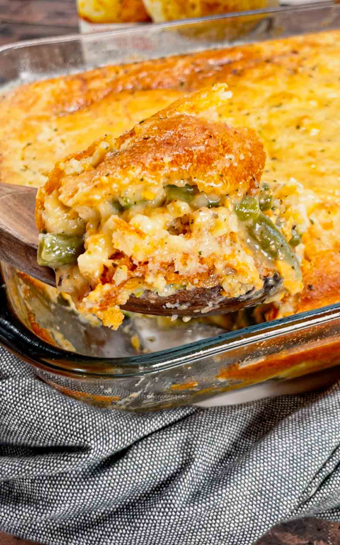 Take your holiday side dish game to the next level with this Cheddar Bay Green Bean Casserole—a creamy, cheesy twist with an irresistible biscuit topping that'll have everyone coming back for seconds! This hearty green bean casserole is loaded with cheddar soup, shredded parmesan and shredded cheddar cheese all covered with a layer Red Lobster Cheddar Bay Biscuits.