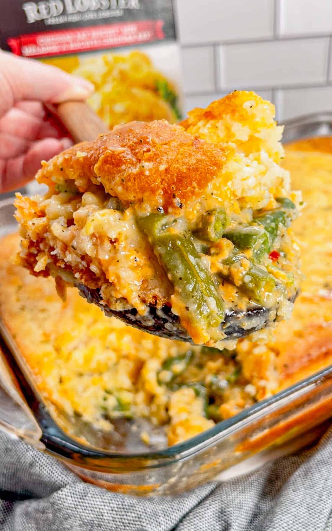 Take your holiday side dish game to the next level with this Cheddar Bay Green Bean Casserole—a creamy, cheesy twist with an irresistible biscuit topping that'll have everyone coming back for seconds! This hearty green bean casserole is loaded with cheddar soup, shredded parmesan and shredded cheddar cheese all covered with a layer Red Lobster Cheddar Bay Biscuits.