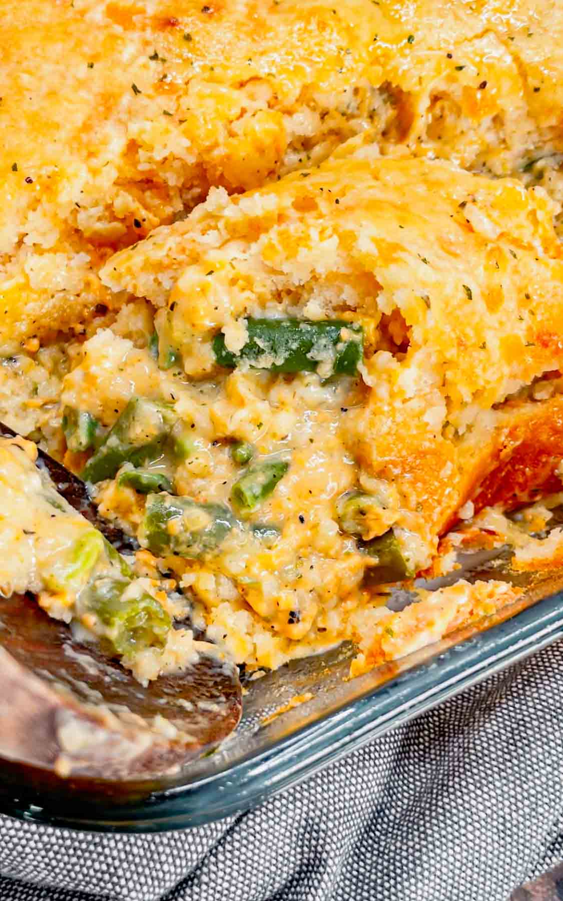 Take your holiday side dish game to the next level with this Cheddar Bay Green Bean Casserole—a creamy, cheesy twist with an irresistible biscuit topping that'll have everyone coming back for seconds! This hearty green bean casserole is loaded with cheddar soup, shredded parmesan and shredded cheddar cheese all covered with a layer Red Lobster Cheddar Bay Biscuits.