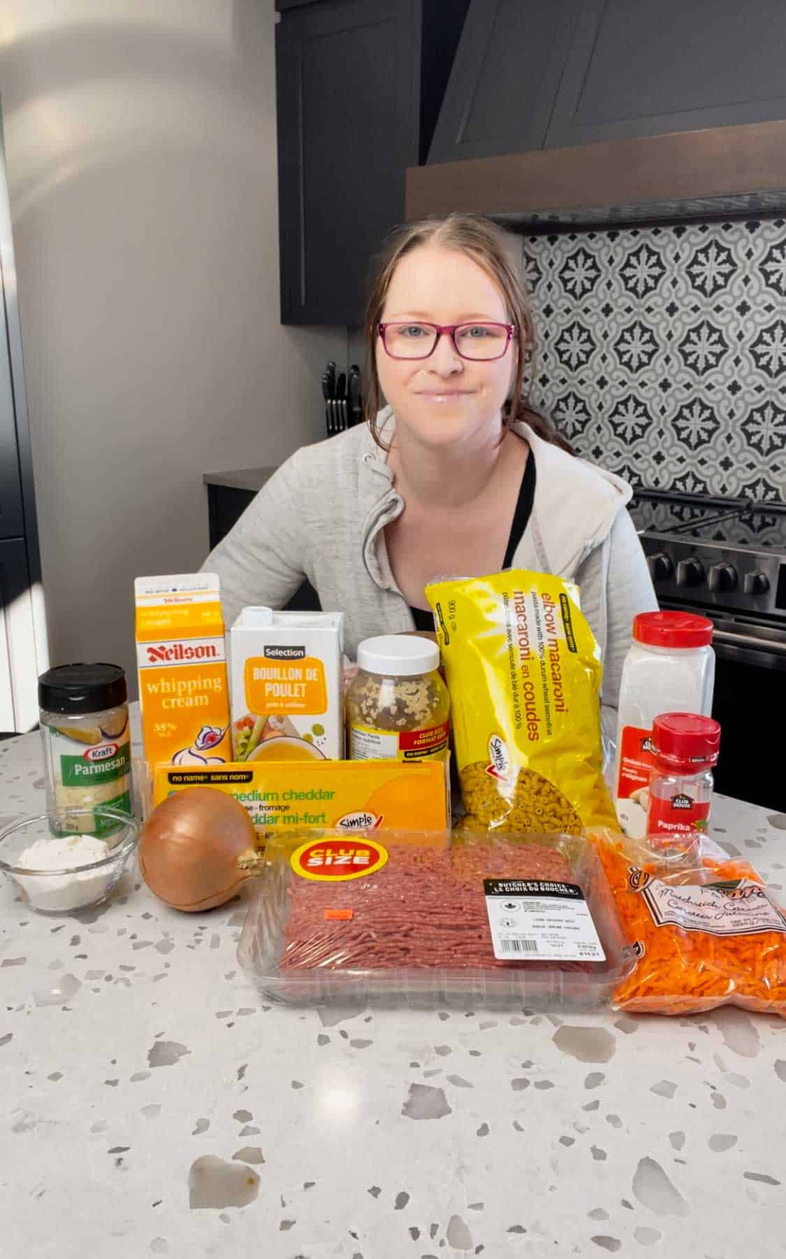 cheeseburger macaroni soup ingredients on a kitchen counter