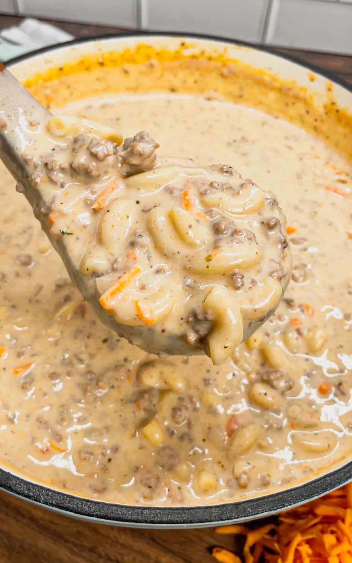 If you love the flavors of a classic cheeseburger, this creamy, cheesy Cheeseburger Macaroni Soup will become your new favorite comfort food—ready in just one pot and guaranteed to satisfy every craving! This hearty soup is loaded with ground beef, matchstick carrots, macaroni noodles, cheddar cheese, parmesan cheese, chicken broth and heavy cream.