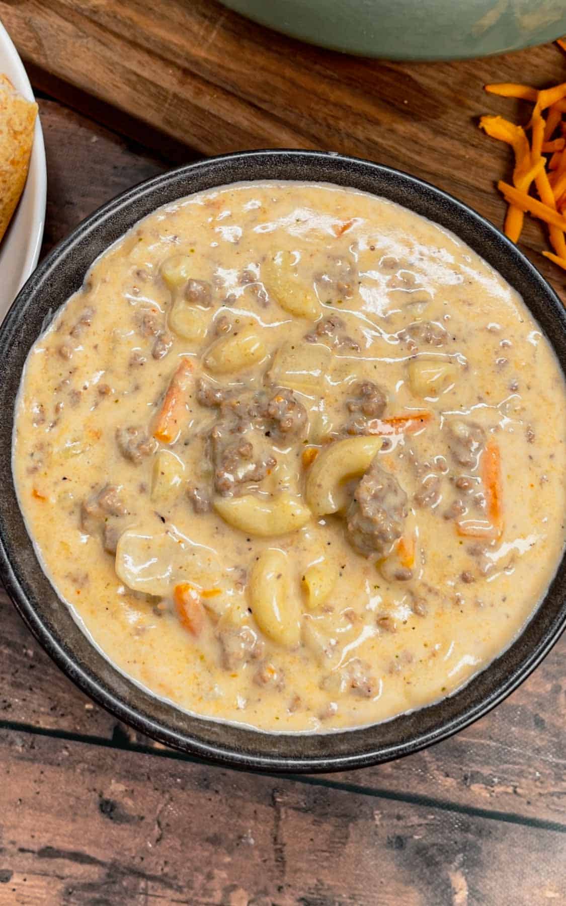 If you love the flavors of a classic cheeseburger, this creamy, cheesy Cheeseburger Macaroni Soup will become your new favorite comfort food—ready in just one pot and guaranteed to satisfy every craving! This hearty soup is loaded with ground beef, matchstick carrots, macaroni noodles, cheddar cheese, parmesan cheese, chicken broth and heavy cream.