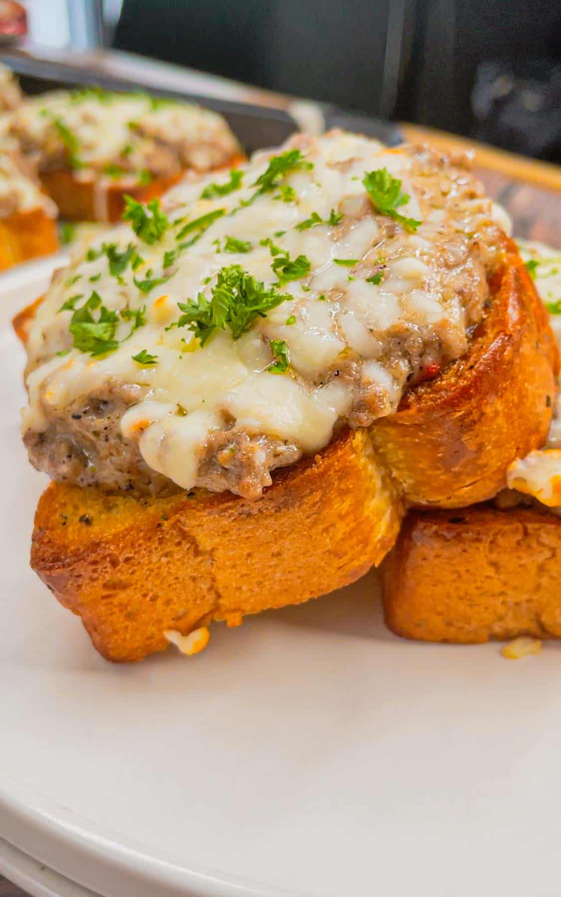 Transform your weeknight dinner game with this irresistible Garlic Parmesan Texas Toast Sloppy Joe recipe—a mouthwatering mashup of comfort food classics! This super easy dinner recipe is made with frozen Texas toast garlic bread slices loaded with ground beef in a creamy garlic parmesan alfredo sauce and topped with mozzarella cheese.