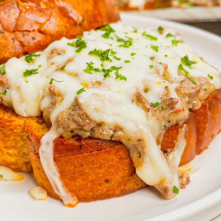 Transform your weeknight dinner game with this irresistible Garlic Parmesan Texas Toast Sloppy Joe recipe—a mouthwatering mashup of comfort food classics! This super easy dinner recipe is made with frozen Texas toast garlic bread slices loaded with ground beef in a creamy garlic parmesan alfredo sauce and topped with mozzarella cheese.