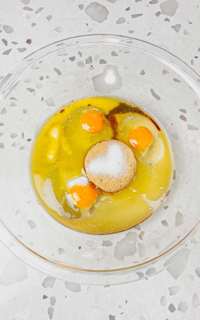 corn syrup, brown sugar, eggs, vanilla extract, melted butter and salt in a glass bowl