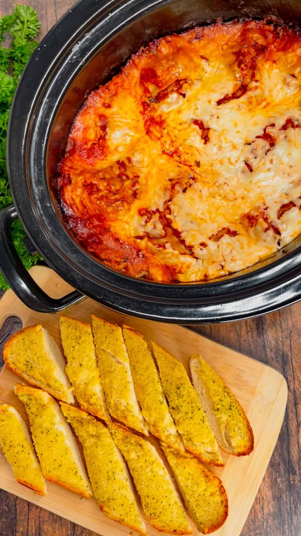 This Crock Pot lasagna is a game changer—layer after layer of savory, cheesy goodness that practically cooks itself! This hearty slower cooker dish is packed with ground beef, marinara, lasagna noodles, ricotta, Alfredo sauce, mozzarella and parmesan cheese.
