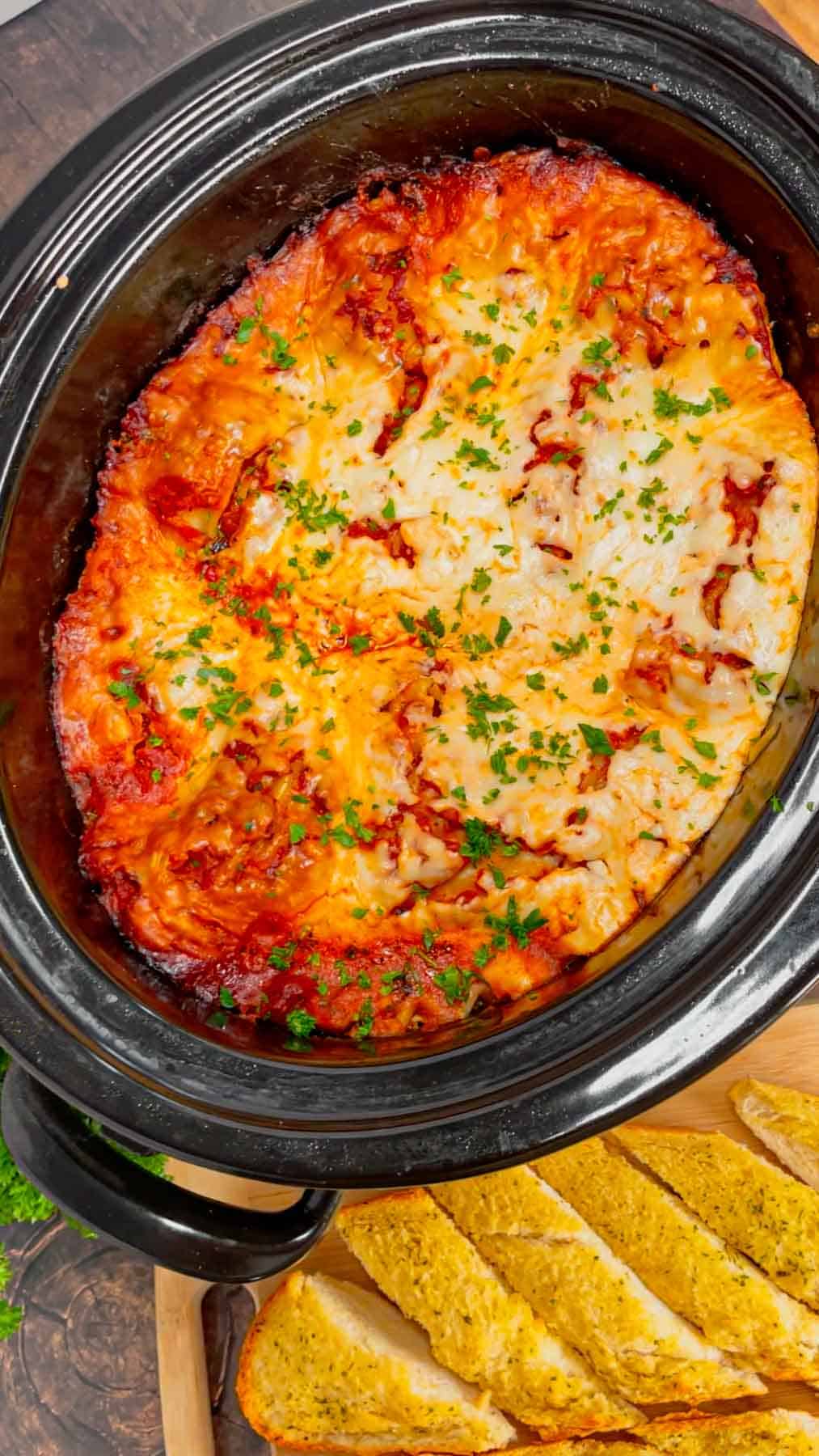 This Crock Pot lasagna is a game changer—layer after layer of savory, cheesy goodness that practically cooks itself! This hearty slower cooker dish is packed with ground beef, marinara, lasagna noodles, ricotta, Alfredo sauce, mozzarella and parmesan cheese.
