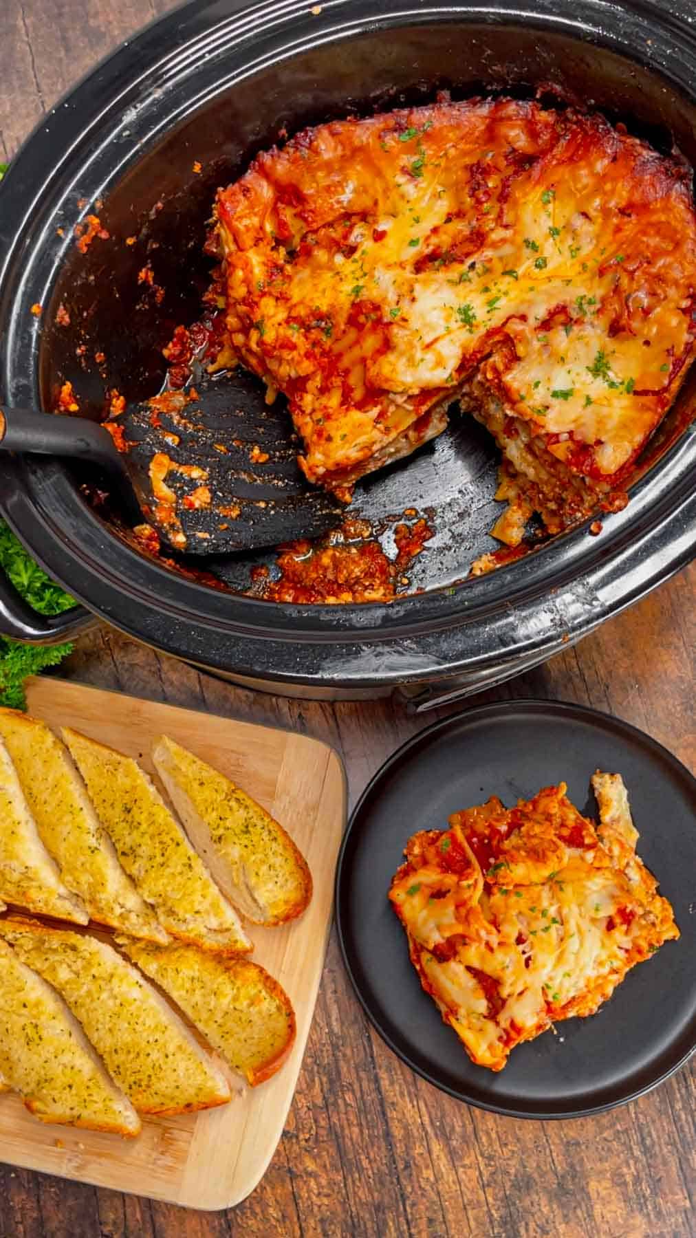 This Crock Pot lasagna is a game changer—layer after layer of savory, cheesy goodness that practically cooks itself! This hearty slower cooker dish is packed with ground beef, marinara, lasagna noodles, ricotta, Alfredo sauce, mozzarella and parmesan cheese.