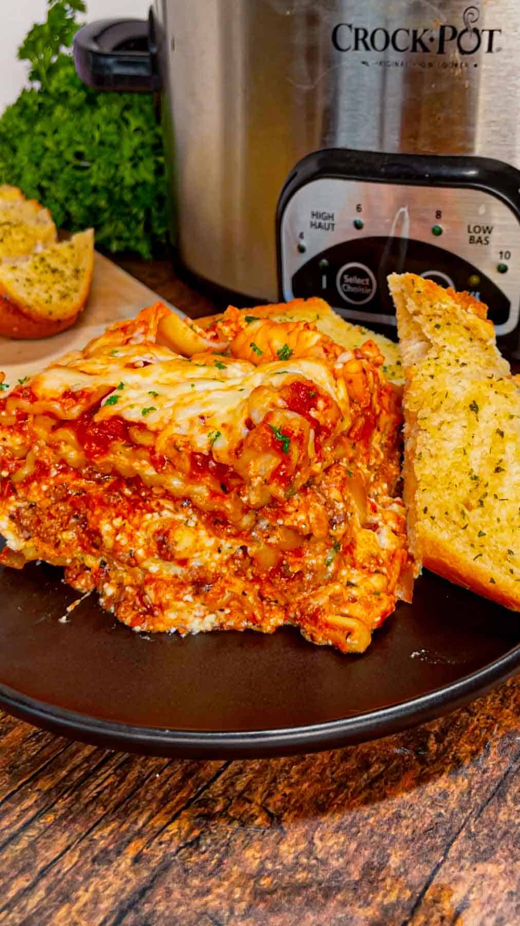 This Crock Pot lasagna is a game changer—layer after layer of savory, cheesy goodness that practically cooks itself! This hearty slower cooker dish is packed with ground beef, marinara, lasagna noodles, ricotta, Alfredo sauce, mozzarella and parmesan cheese.