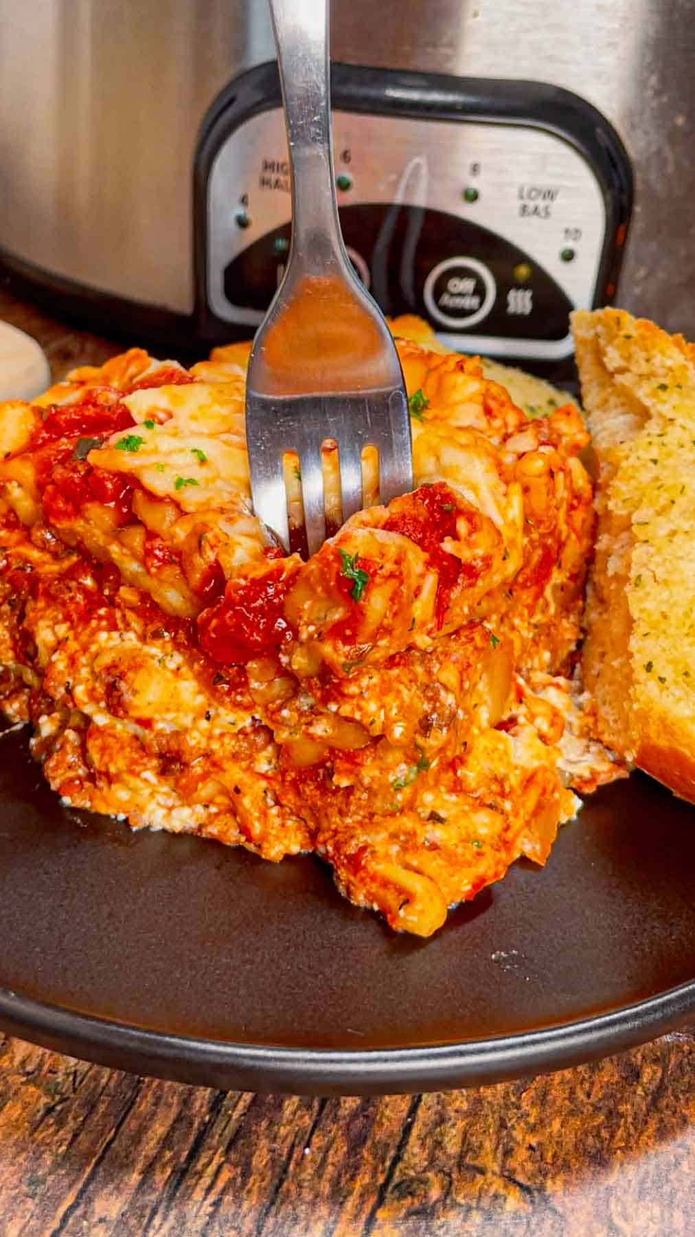This Crock Pot lasagna is a game changer—layer after layer of savory, cheesy goodness that practically cooks itself! This hearty slower cooker dish is packed with ground beef, marinara, lasagna noodles, ricotta, Alfredo sauce, mozzarella and parmesan cheese.