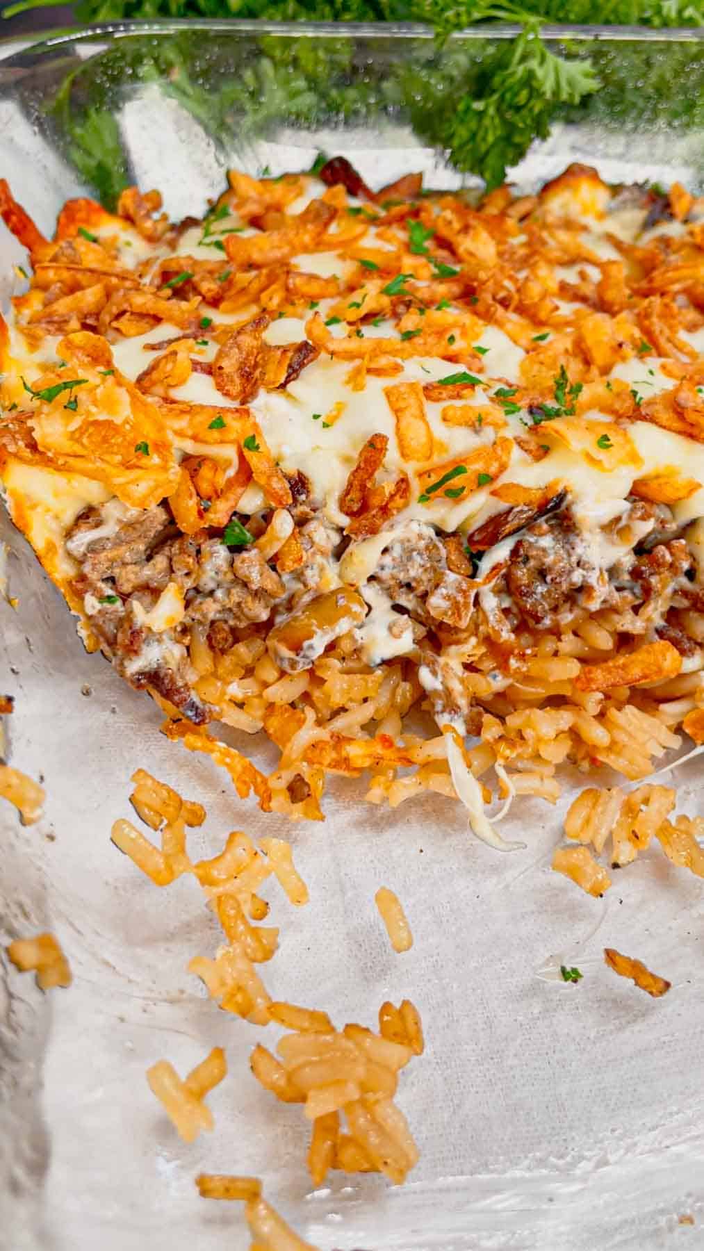 French Onion Ground Beef and Rice Casserole is a hearty dish loaded with instant rice, ground beef, diced onions, onion soup mix, beef broth, sour cream, mozzarella cheese and crispy fried onions.