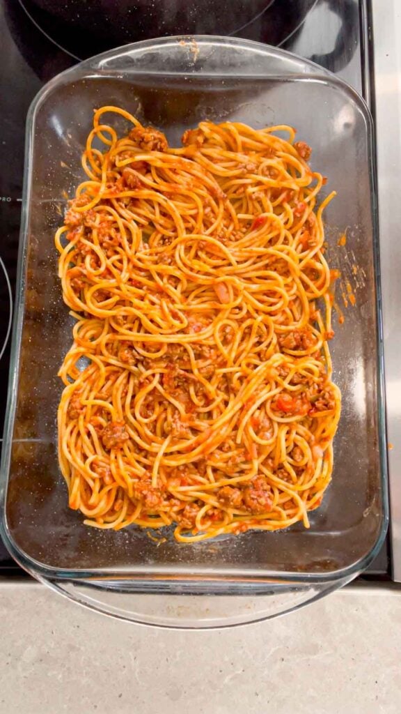 ground beef and marinara spaghetti mixture in a baking dish