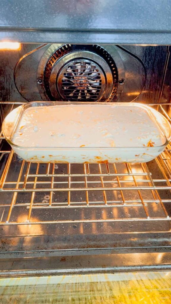 cheddar bay spaghetti casserole placed in an oven to bake