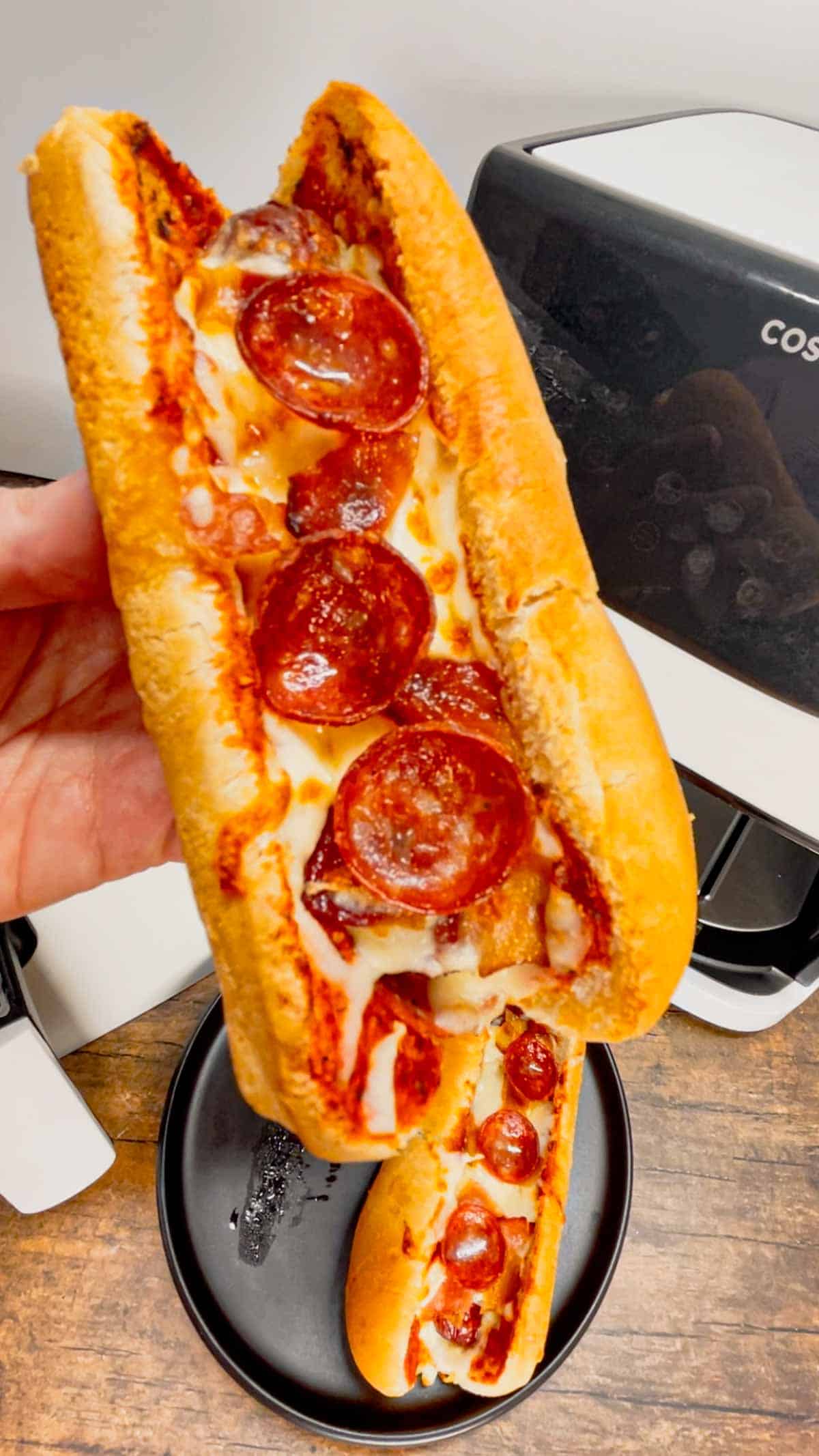 Air Fryer Pizza Dogs are a fun and easy recipe perfect for lunch or a quick weeknight dinner. These tasty hot dogs are loaded with pizza sauce, mozzarella cheese, pepperoni and bacon all air fried to crispy perfection.
