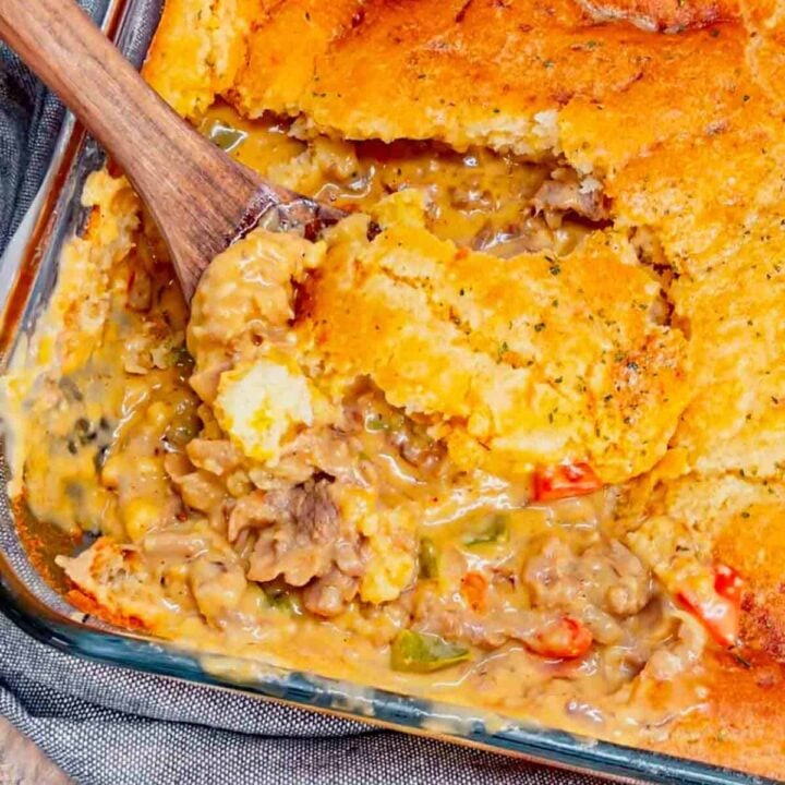 Cheddar Bay Philly Cheese Steak Cobbler is a hearty dish loaded with deli roast beef, red onions, red and green bell peppers, cheddar soup and shredded cheddar cheese all topped with a layer of Red Lobster Cheddar Bay Biscuits. This easy casserole recipe is the perfect family friendly dinner recipe.