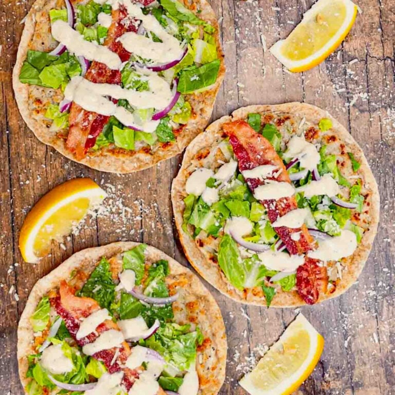 Chicken Caesar Smash Tacos are an dinner recipe made with flour tortillas, ground chicken, chopped romaine, Caesar dressing, bacon and parmesan cheese. These tasty tacos are cooked on a griddle or in a skillet just like classic smash burgers.