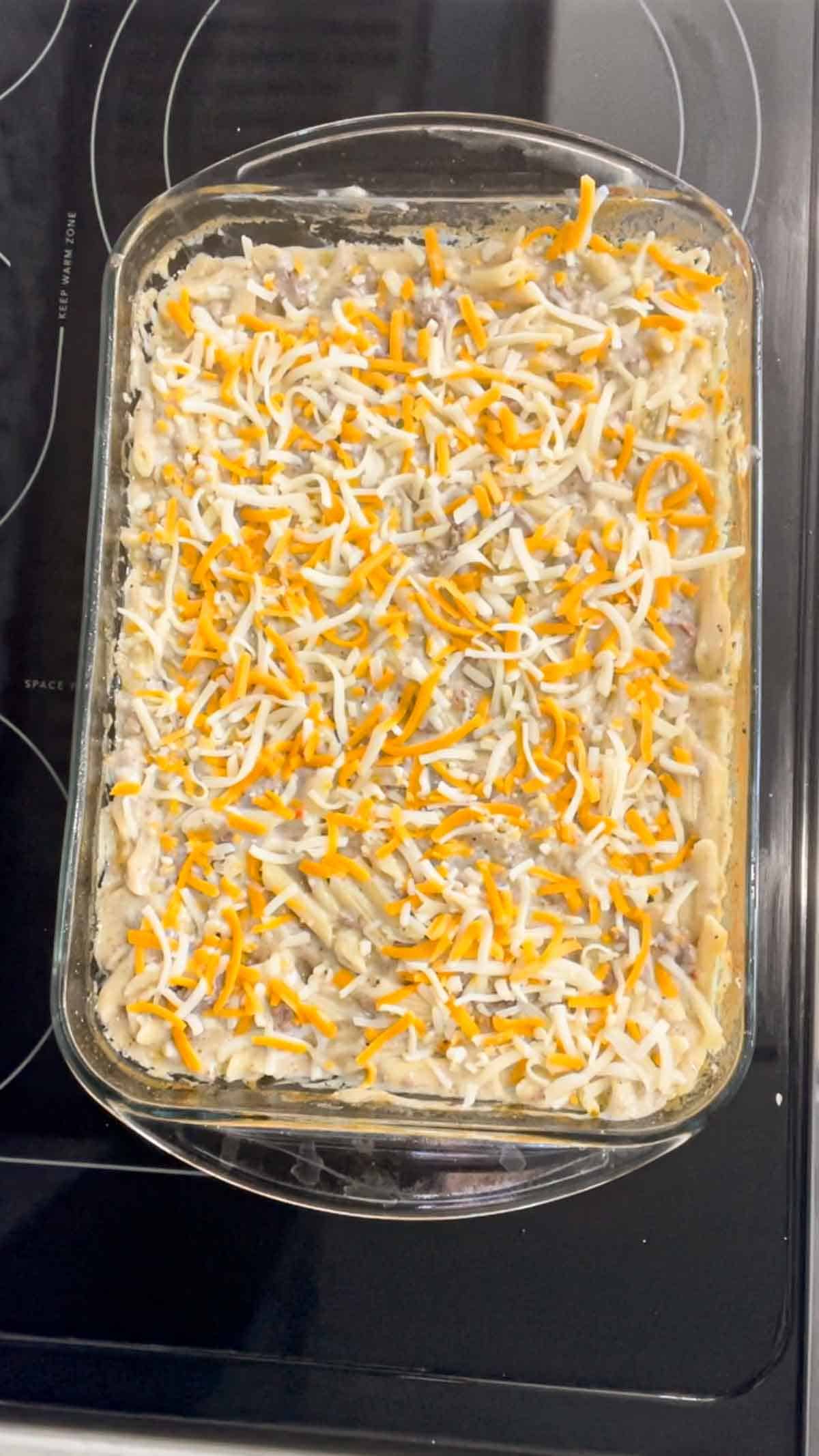 shredded mozzarella and cheddar cheese on top of dump and bake alfredo in a baking dish