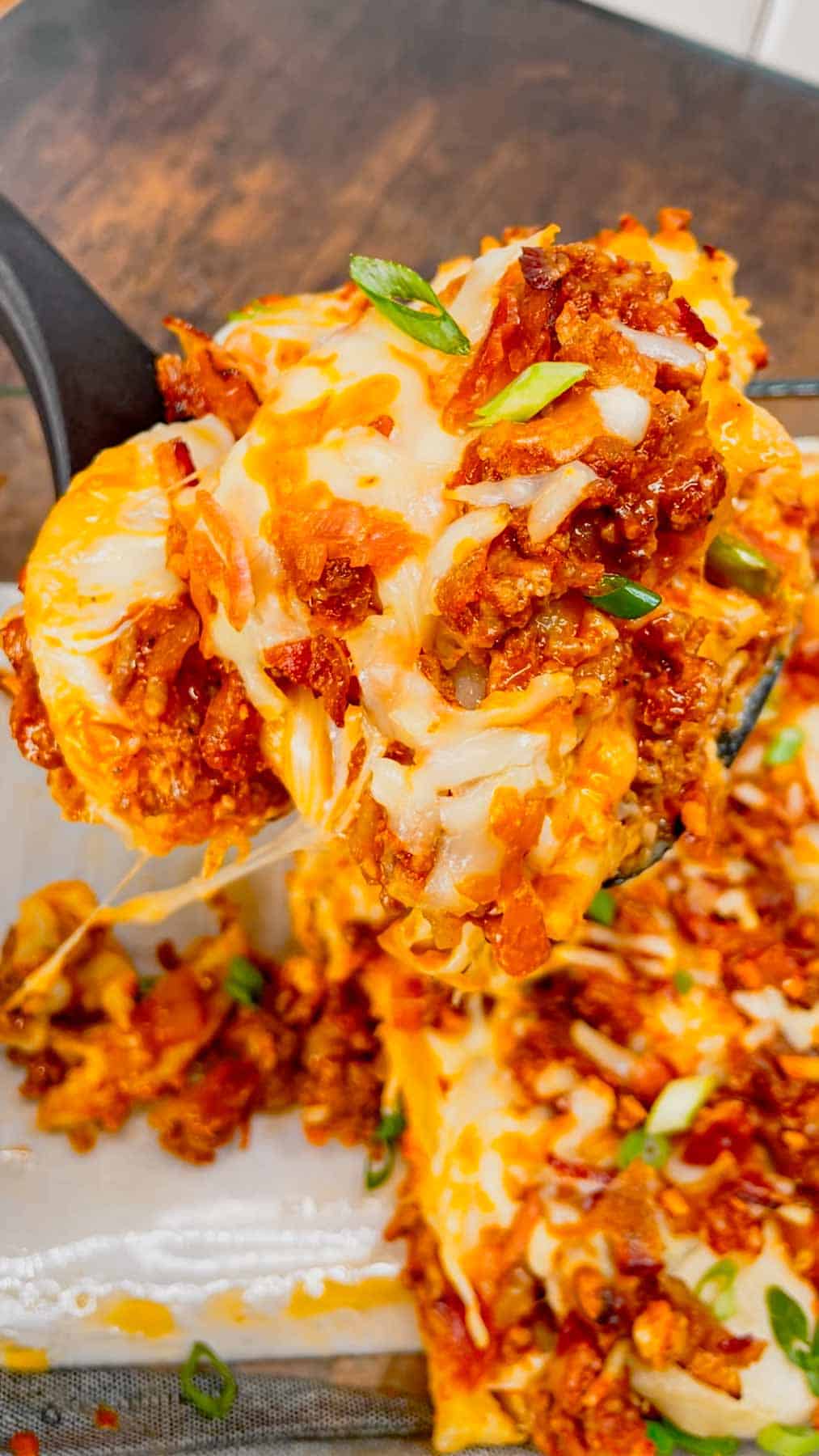 Sloppy Joe Pierogi Casserole is a hearty casserole that is super easy to throw together. This easy casserole recipe uses store bought frozen pierogies, ground beef, a homemade sloppy joe sauce, shredded mozzarella and cheddar cheese, bacon and green onions.
