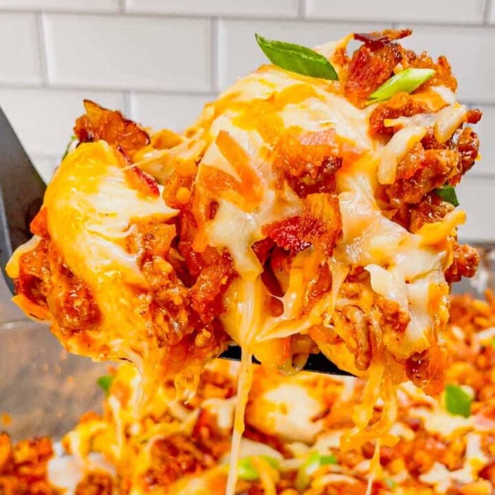 Sloppy Joe Pierogi Casserole is a hearty casserole that is super easy to throw together. This easy casserole recipe uses store bought frozen pierogies, ground beef, a homemade sloppy joe sauce, shredded mozzarella and cheddar cheese, bacon and green onions.