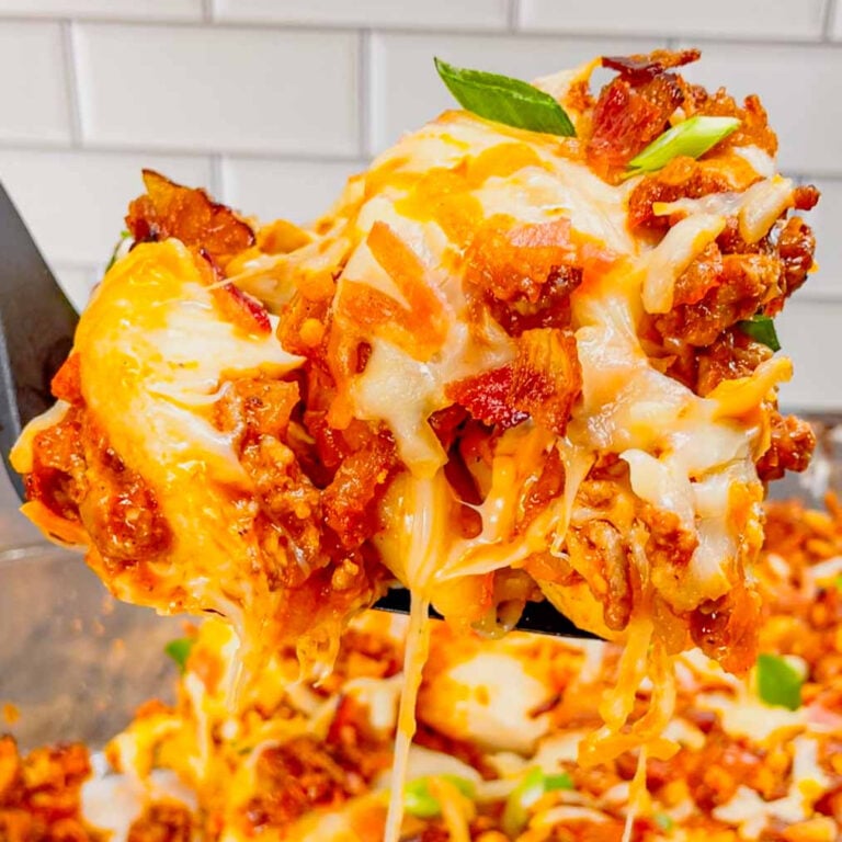 Sloppy Joe Pierogi Casserole is a hearty casserole that is super easy to throw together. This easy casserole recipe uses store bought frozen pierogies, ground beef, a homemade sloppy joe sauce, shredded mozzarella and cheddar cheese, bacon and green onions.