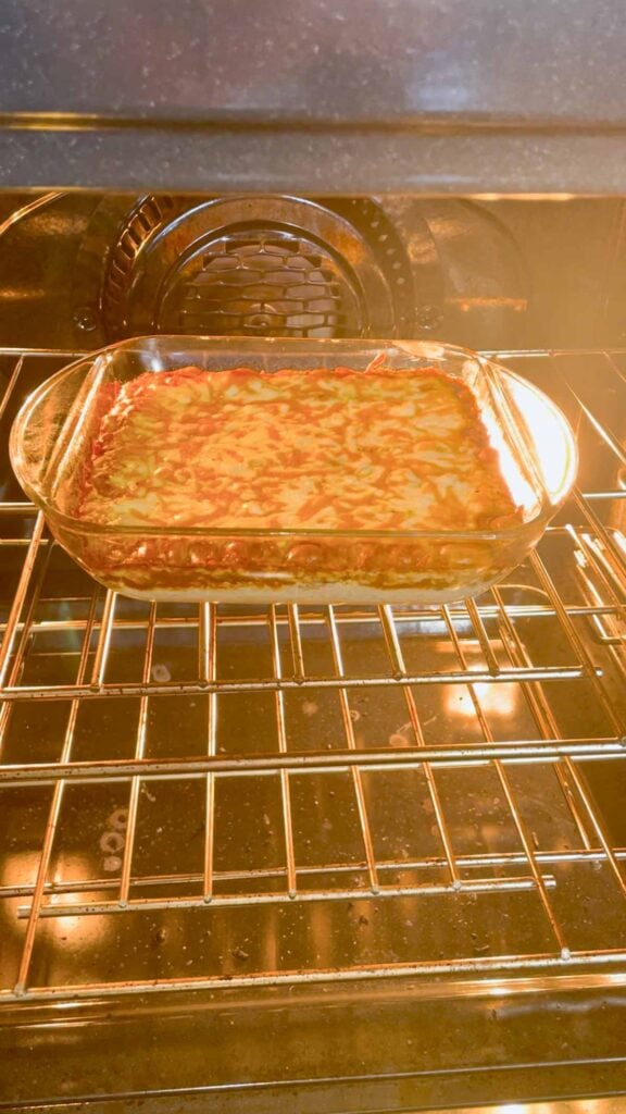 cream cheese chili dip baking until bubbling in the oven