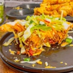 Individual Taco Pot Pies are a fun and hearty ground beef dinner recipe perfect for weeknights. These pot pies are made with store bought puff pastry, filled with a beef taco meat, Rotel and cheese and baked in jumbo muffin tins until perfectly browned and flaky.