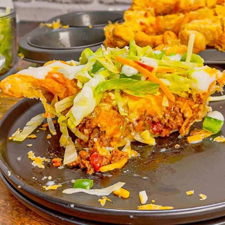 Individual Taco Pot Pies are a fun and hearty ground beef dinner recipe perfect for weeknights. These pot pies are made with store bought puff pastry, filled with a beef taco meat, Rotel and cheese and baked in jumbo muffin tins until perfectly browned and flaky.