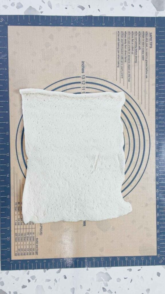 pizza dough on a silicone mat