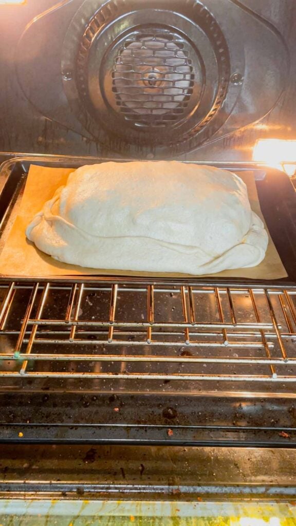 lasagna stuffed pizza dough placed in the oven