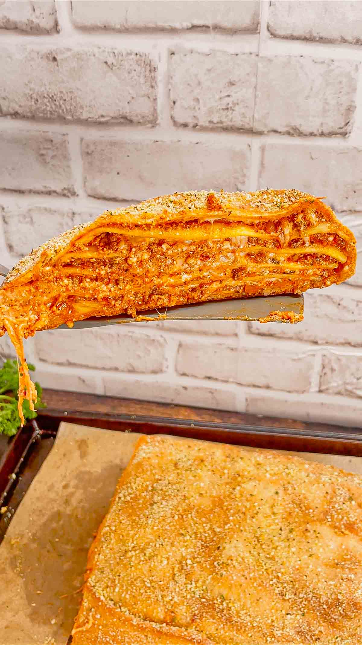 Lasagna Wellington is a fun twist on a classic lasagna that is sure to please the whole family. Pillsbury pizza dough is wrapped around layers of pasta, meat sauce and cheese and then baked until golden brown.