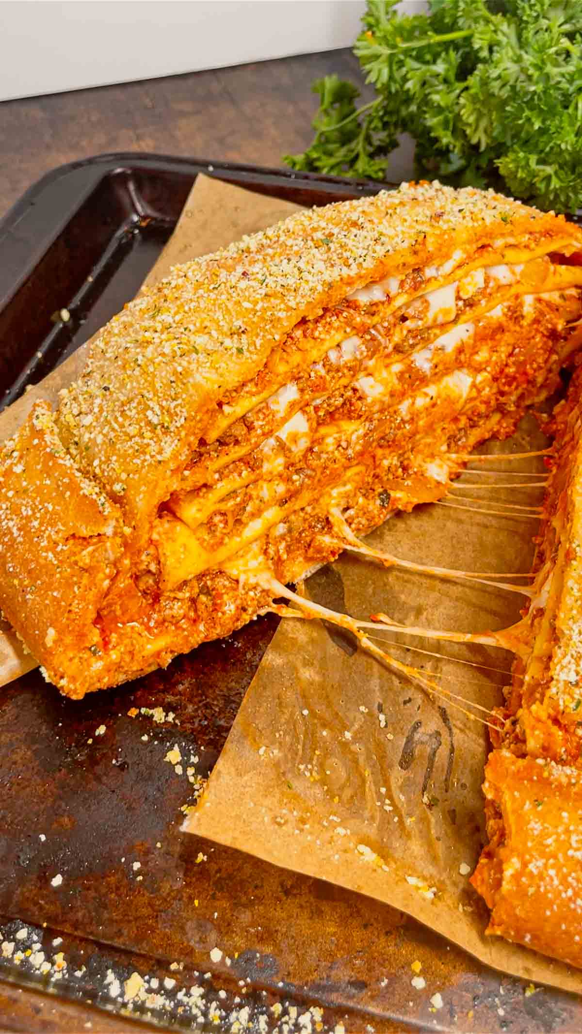 Lasagna Wellington is a fun twist on a classic lasagna that is sure to please the whole family. Pillsbury pizza dough is wrapped around layers of pasta, meat sauce and cheese and then baked until golden brown.