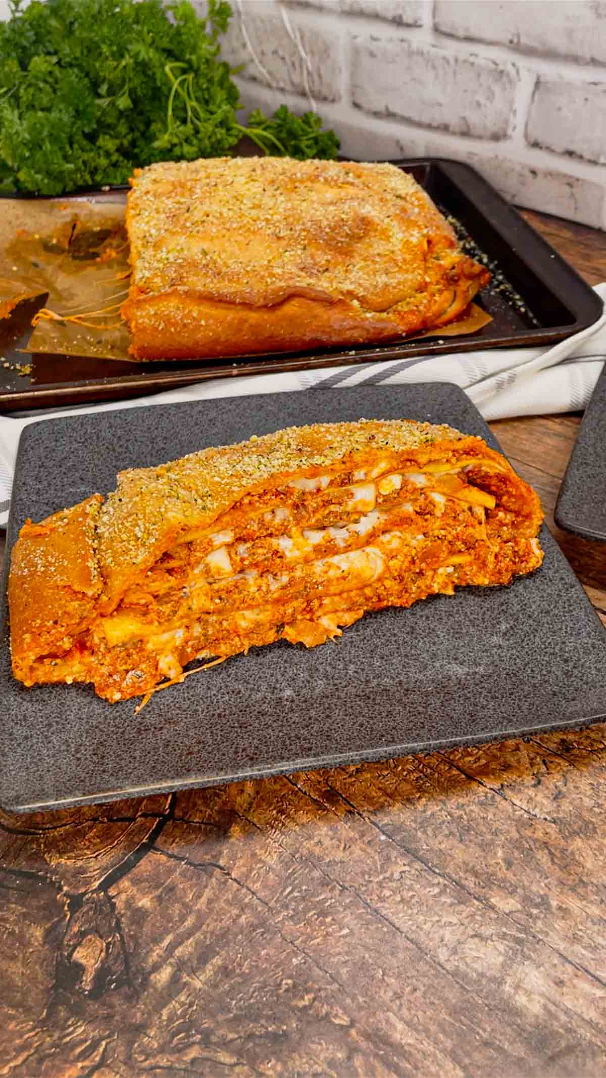 Lasagna Wellington is a fun twist on a classic lasagna that is sure to please the whole family. Pillsbury pizza dough is wrapped around layers of pasta, meat sauce and cheese and then baked until golden brown.