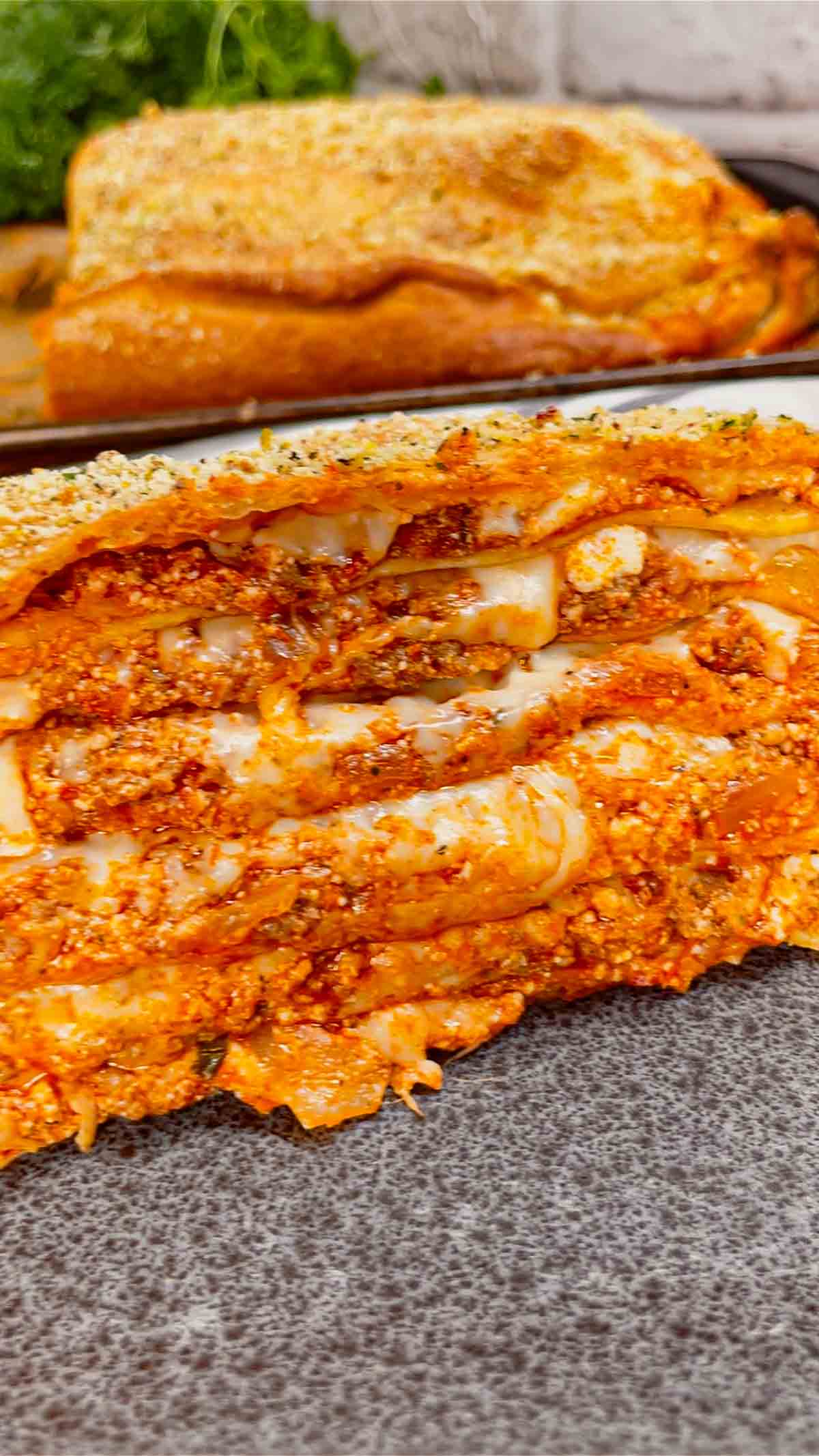 Lasagna Wellington is a fun twist on a classic lasagna that is sure to please the whole family. Pillsbury pizza dough is wrapped around layers of pasta, meat sauce and cheese and then baked until golden brown.