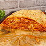 Lasagna Wellington is a fun twist on a classic lasagna that is sure to please the whole family. Pillsbury pizza dough is wrapped around layers of pasta, meat sauce and cheese and then baked until golden brown.