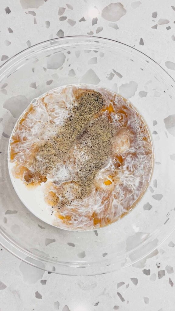 salt, pepper, maple syrup, half and half and eggs in a glass mixing bowl