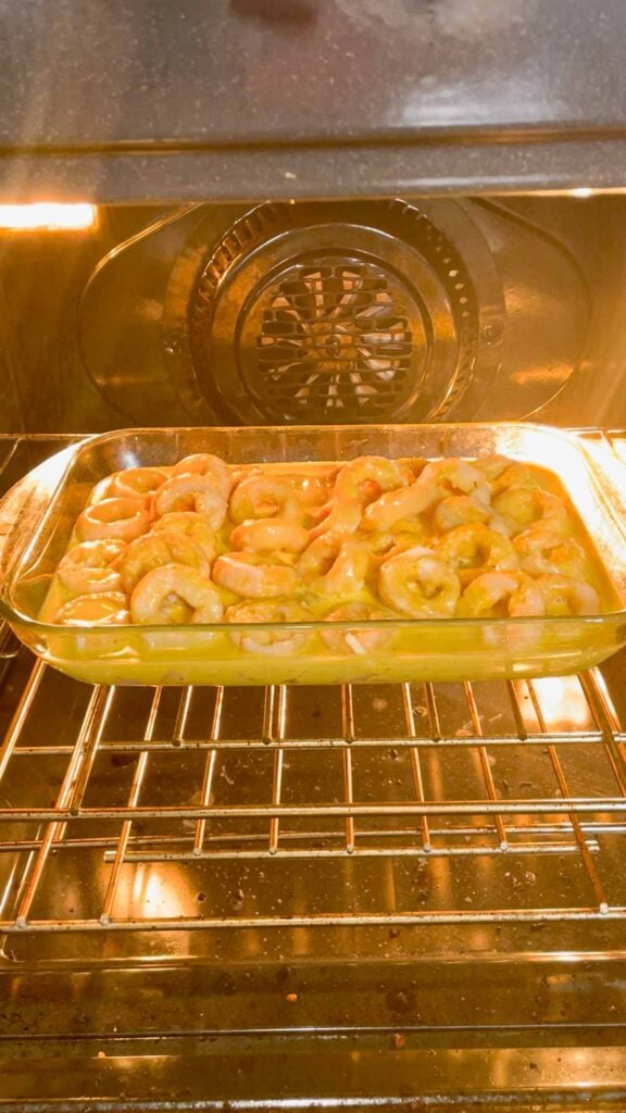 mini donut breakfast casserole placed in the oven to bake
