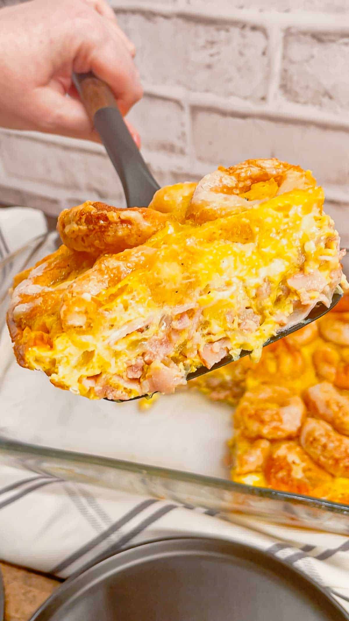 Mini Donut Breakfast Casserole is a fun and delicious brunch dish perfect for holidays and special occasions. This dish is loaded with sausage, ham, eggs, mozzarella cheese, store bought mini donuts and maple syrup.