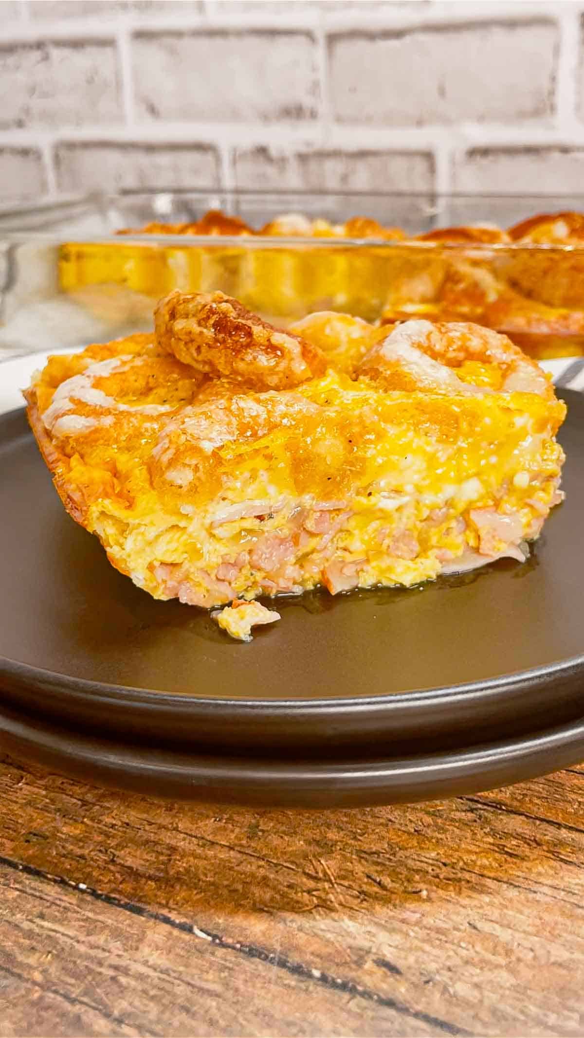 Mini Donut Breakfast Casserole is a fun and delicious brunch dish perfect for holidays and special occasions. This dish is loaded with sausage, ham, eggs, mozzarella cheese, store bought mini donuts and maple syrup.