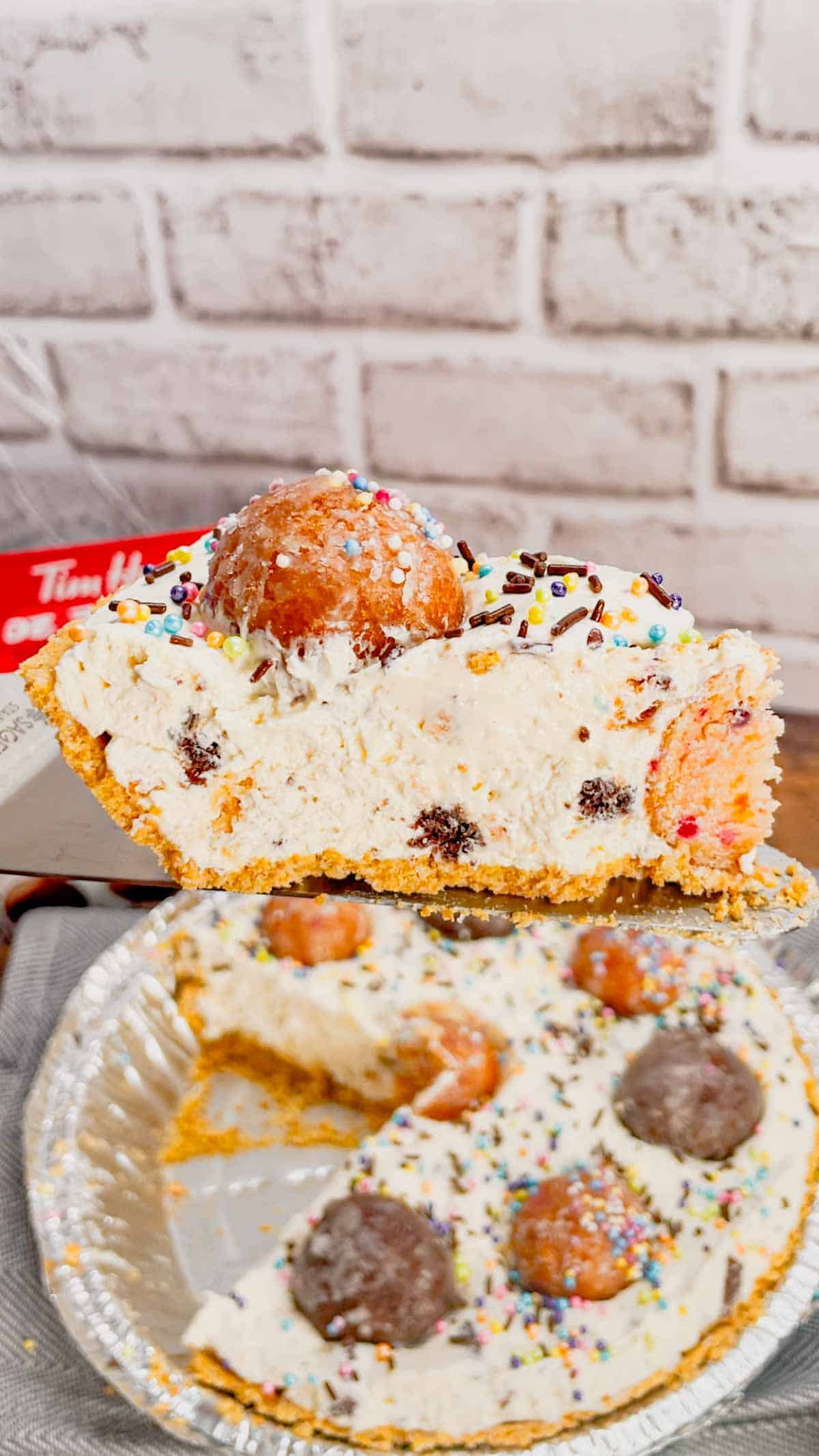 No Bake Timbit Cheesecake is a rich and creamy dessert recipe loaded with tasty donut holes. This cheesecake is made with a store bought graham pie crust and the cream cheese filling is loaded Tim Horton's chocolate and birthday cake flavoured Timbits.