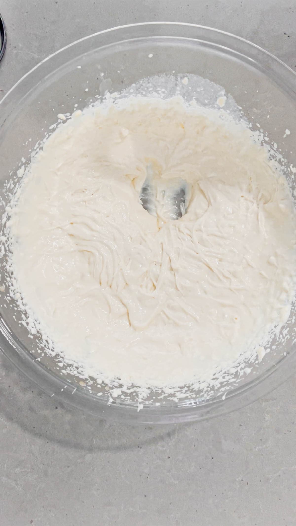 cream cheese mixture in a glass mixing bowl