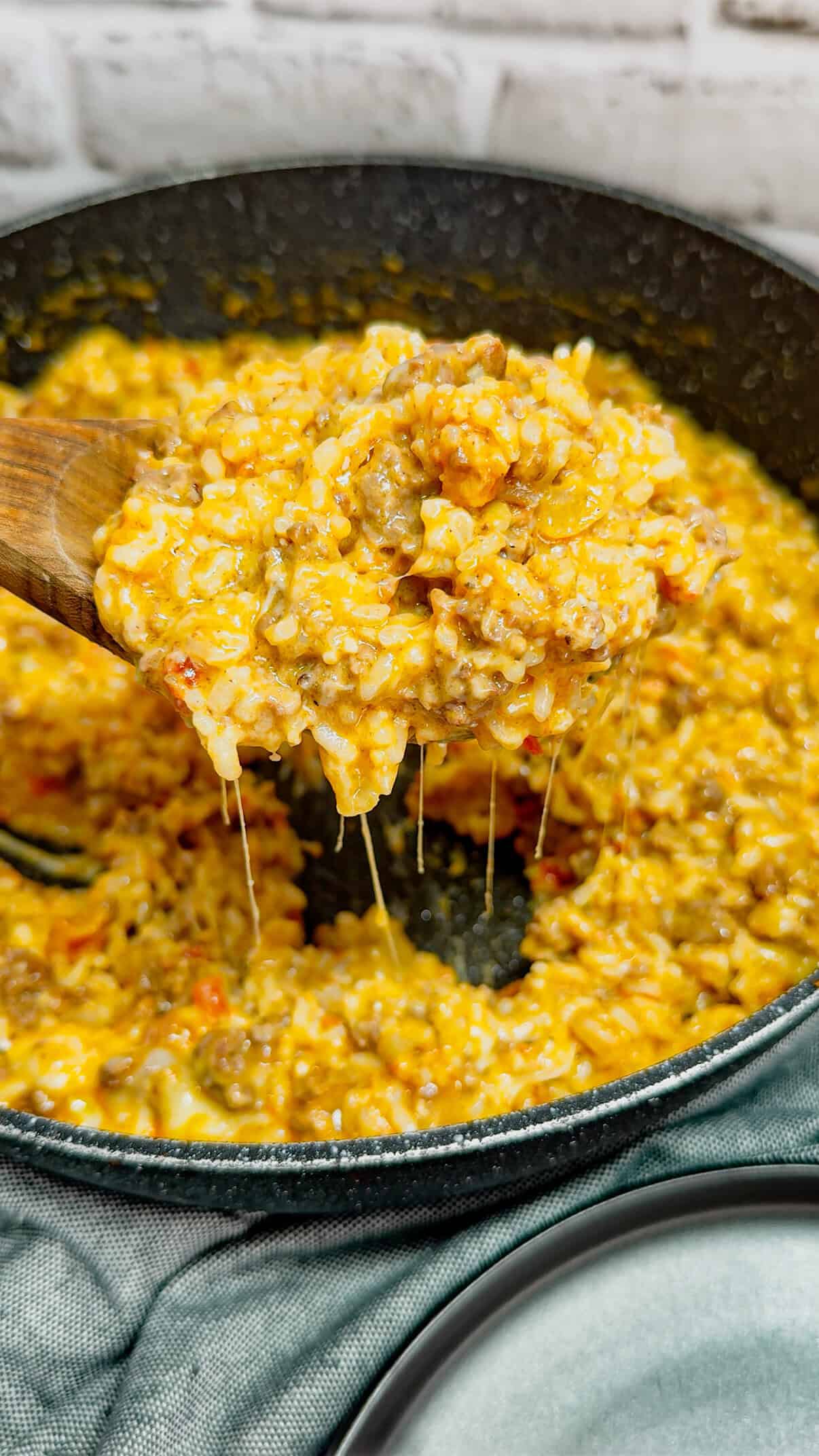 Cheesy Queso Ground Beef and Rice is an easy one pot dinner recipe perfect for busy weeknights. This hearty dish is loaded with ground beef, minute rice, Rotel diced tomatoes and green chilies, store bought salsa con queso and shredded nacho cheese.